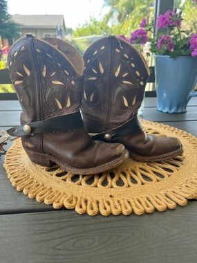Antique kids leather cowboy boots with spurs.